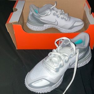 White + gray Nike softball shoes